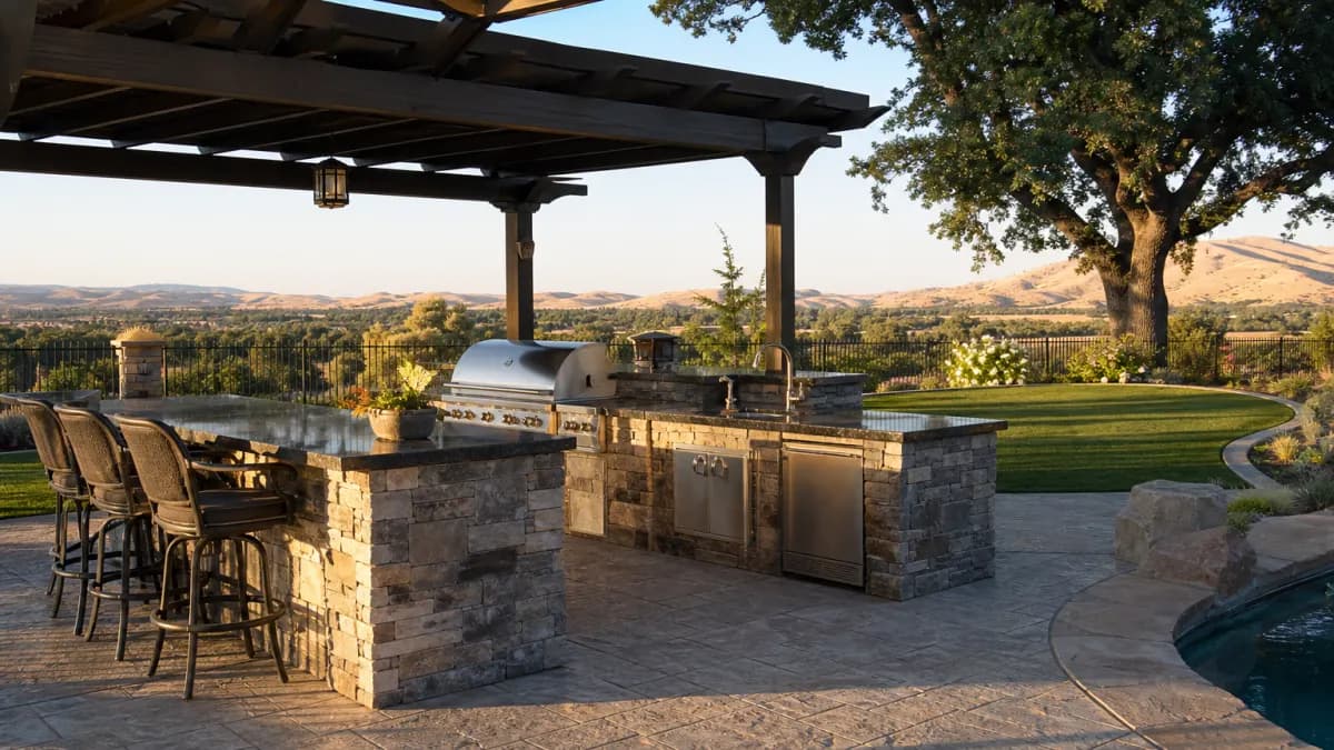 Backyard outdoor kitchen with granite countertops and a built-in grill in a Sacramento-area yard